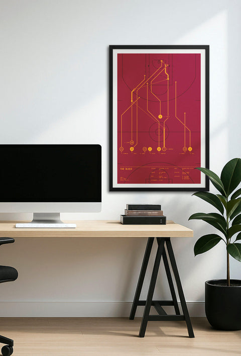 Framed “The Block” play-diagram poster displayed above a minimalist home-office desk, showing wall scale.